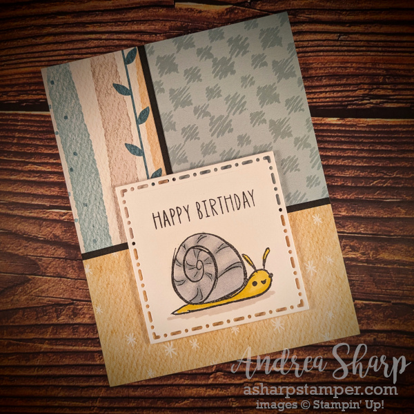 A card with three panels of different patterned papers with a focal image with a snail and "Happy Birthday".